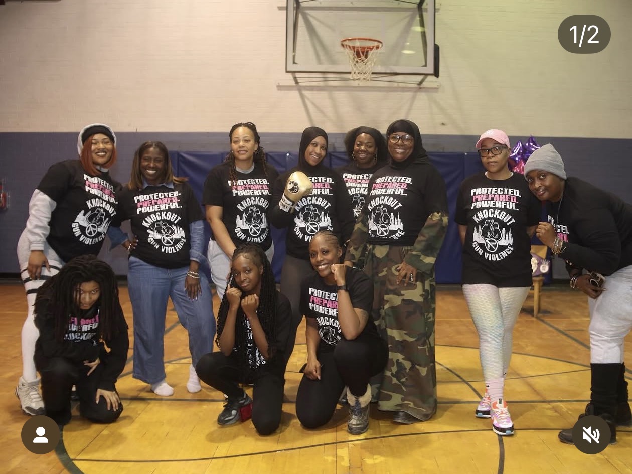 Women's self-defense program group photo wearing Protected Prepared Powerful shirts
