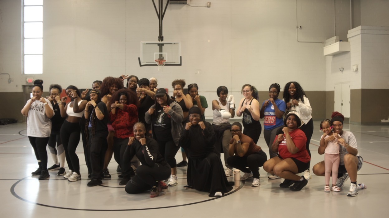 Knockout Gun Violence women's empowerment group at a community gym event